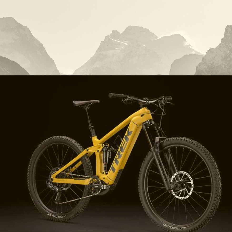 A Yellow Color Ebike With Mountains