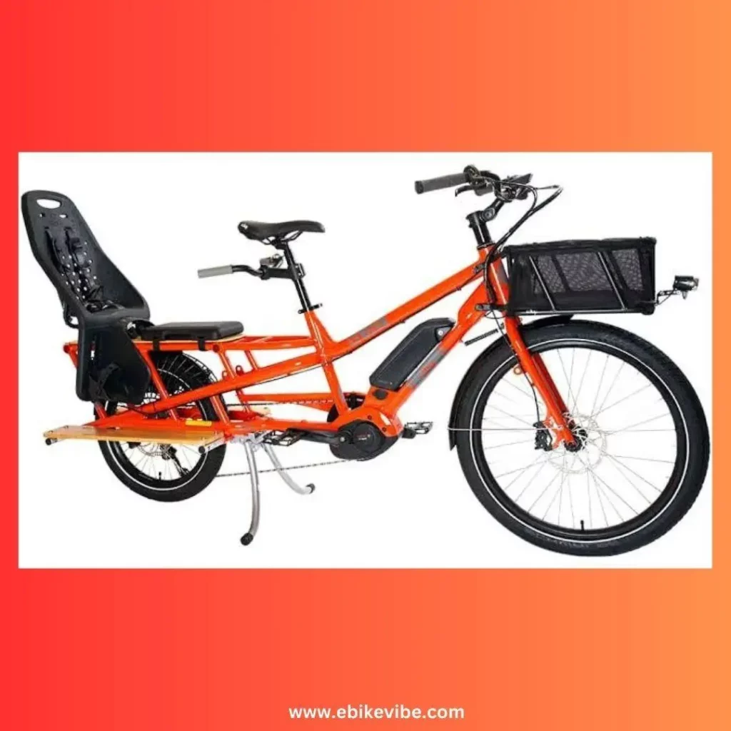 An orange electric cargo bike with a basket and seat.